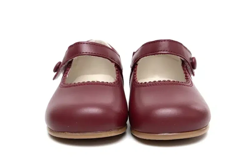 Merceditas botón piel burdeos niña